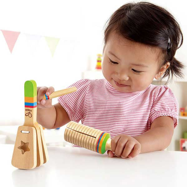 Toddler playing rhythm set